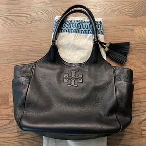 Like new Authentic Tory Burch Thea Round Tote with original duster bag included.